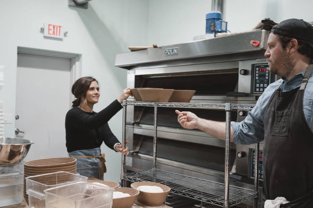 Bakers preparing bread in a commercial kitchen with Polin oven.