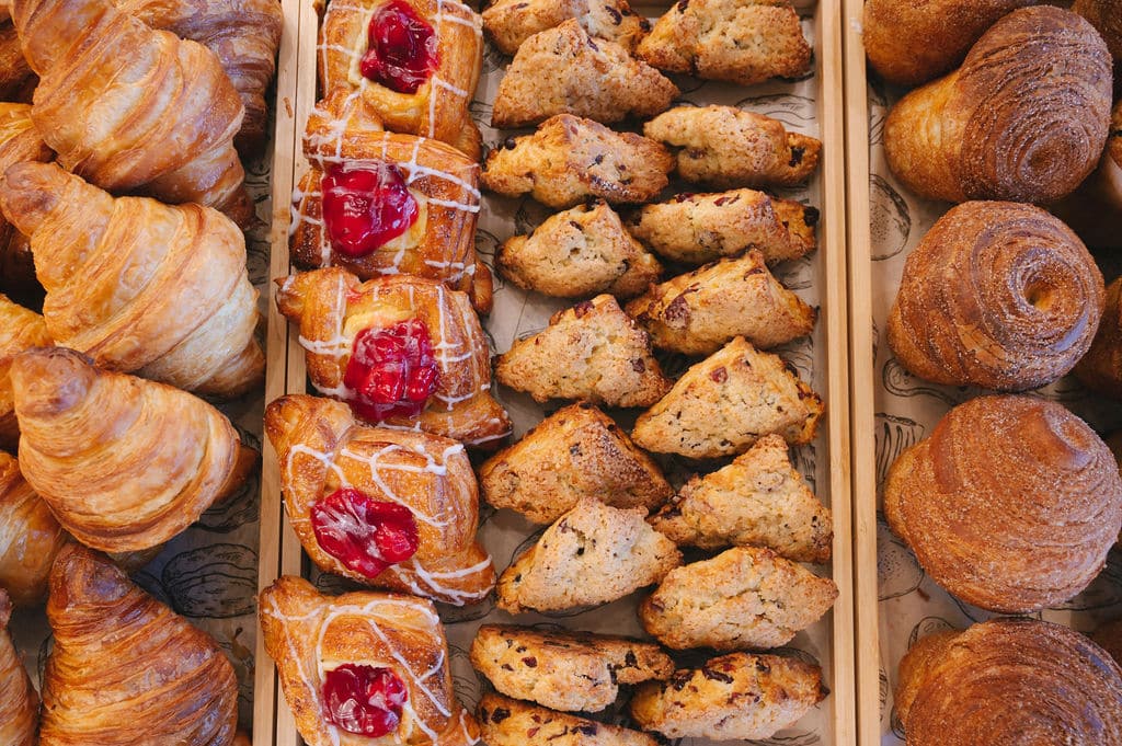 Fresh croissants, cherry danishes, and scones at a New Smyrna Beach bakery. Specialty desserts.