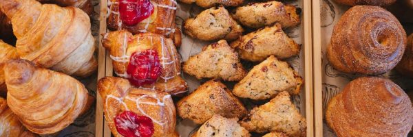 Fresh croissants, cherry danishes, and scones at a New Smyrna Beach bakery. Specialty desserts.